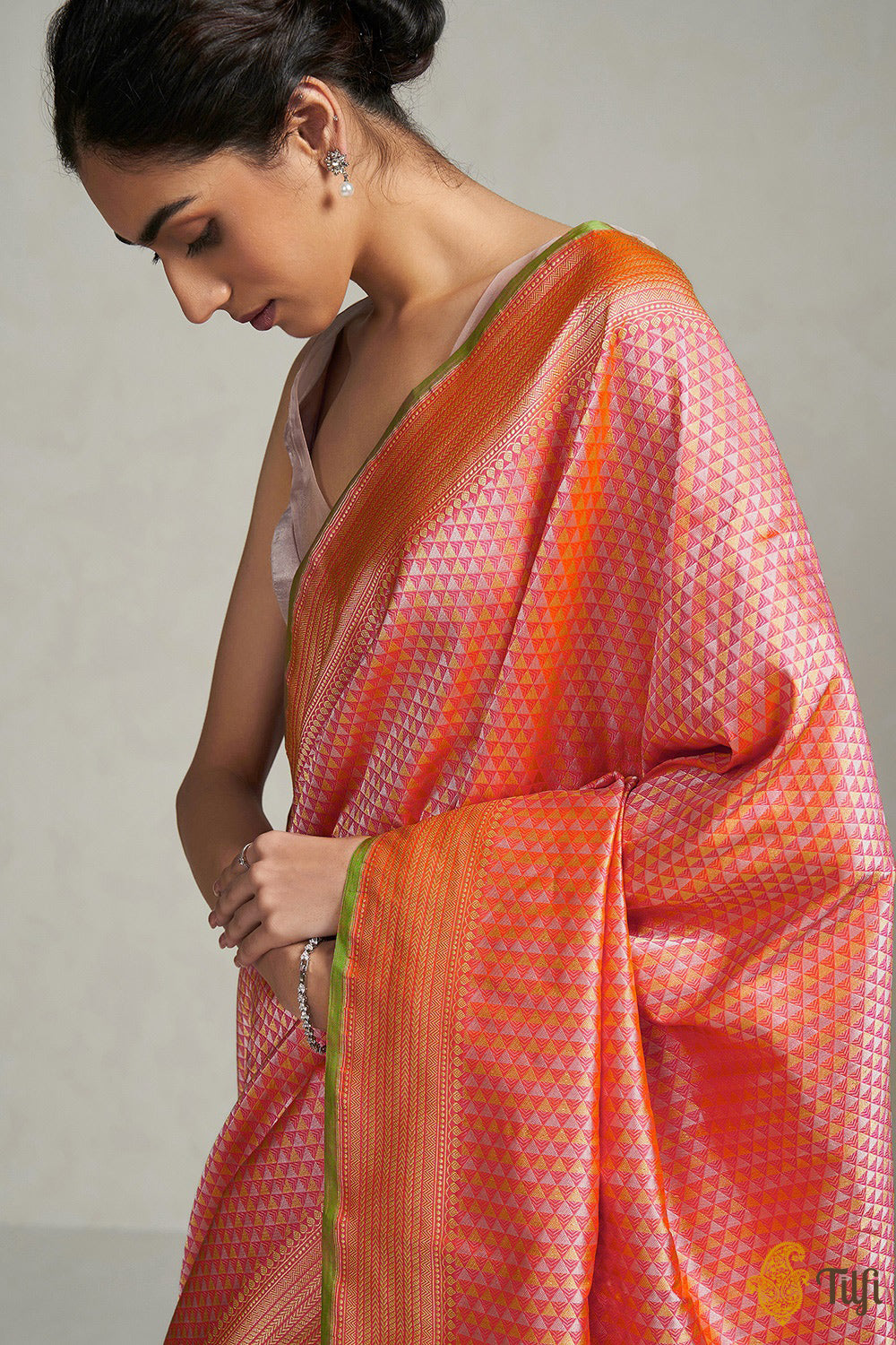 Orange embossed silk saree with double korvai borders in floral design &  pallu featuring lots of tiny flowers in zari